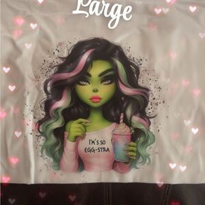 Graphic Tee with Green Character and Pink Accents